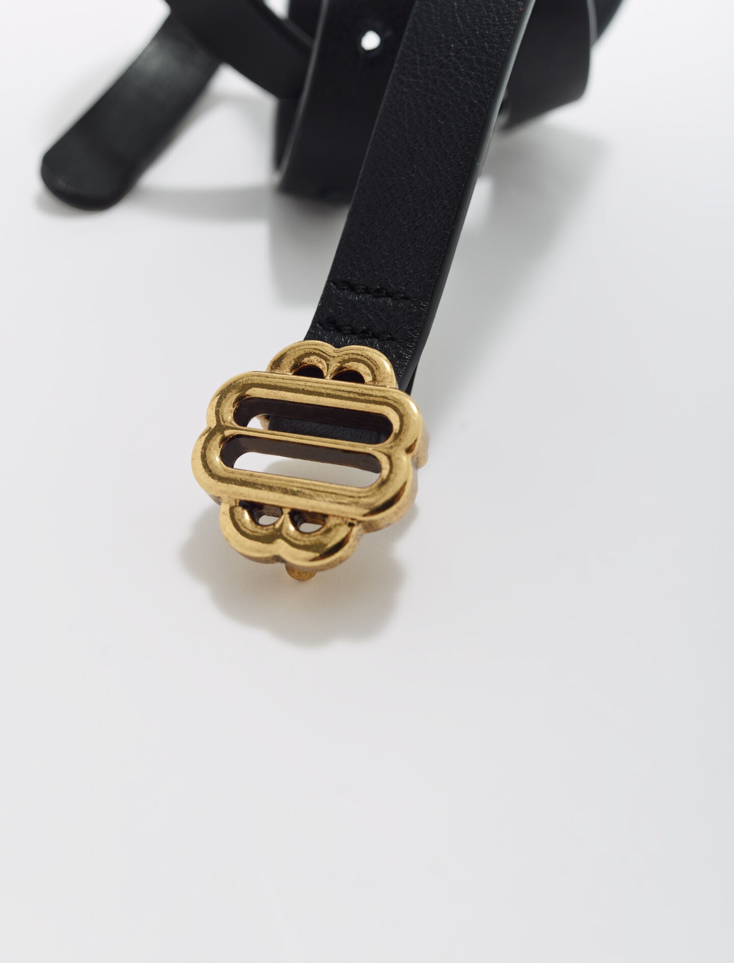 Black-narrow black leather belt gold buckle
