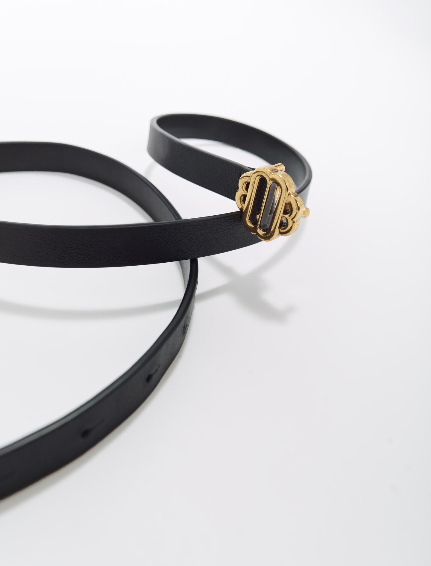 Black-narrow black leather belt gold buckle