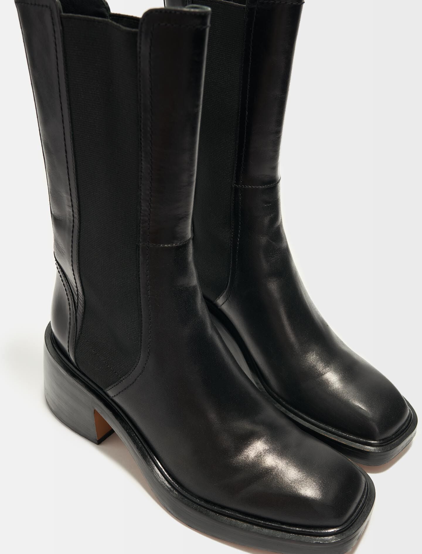 Black-black leather ankle boots and square toe