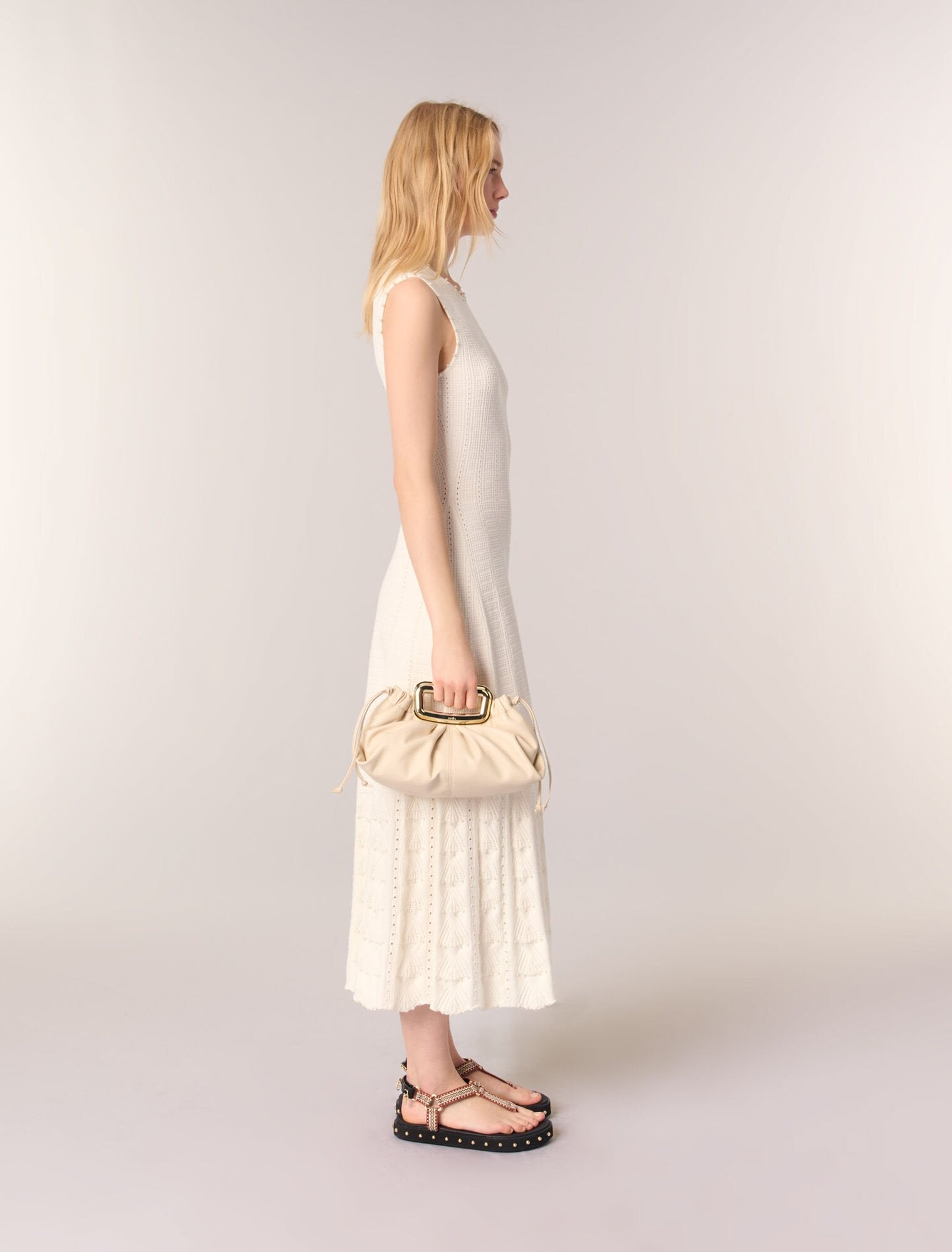 Ecru-Metal handle leather clutch