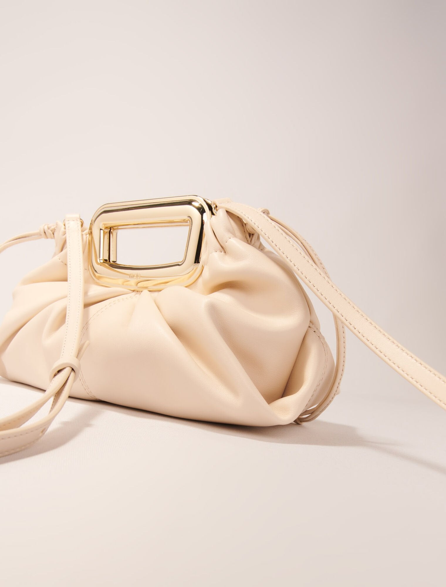 Ecru-Metal handle leather clutch