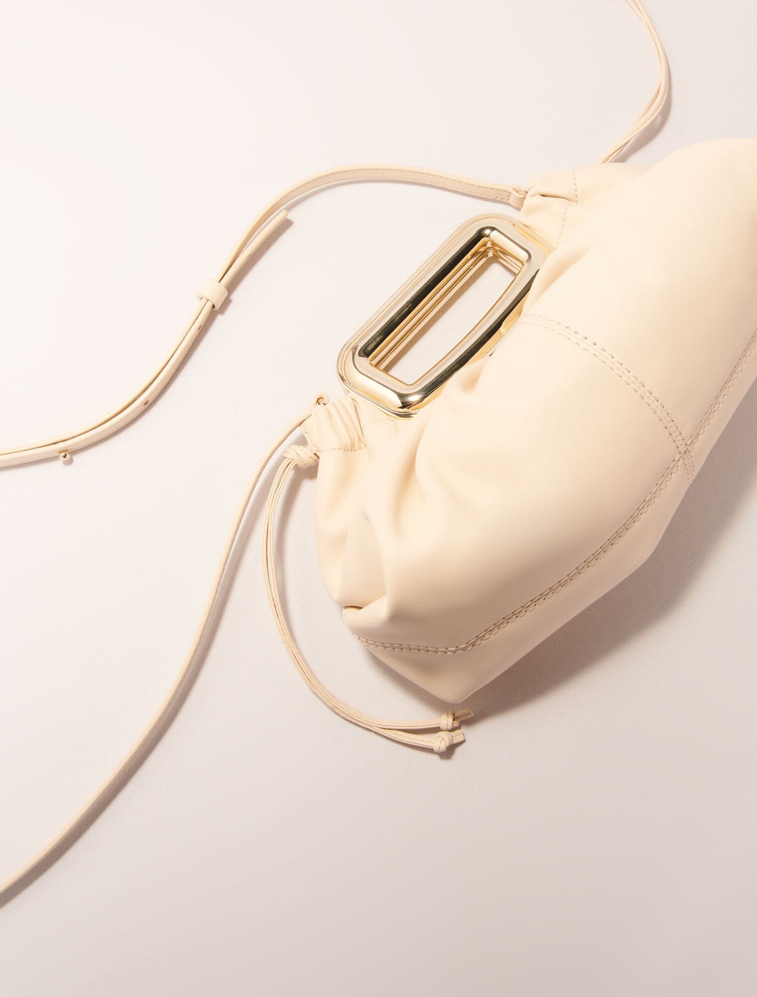 Ecru-Metal handle leather clutch