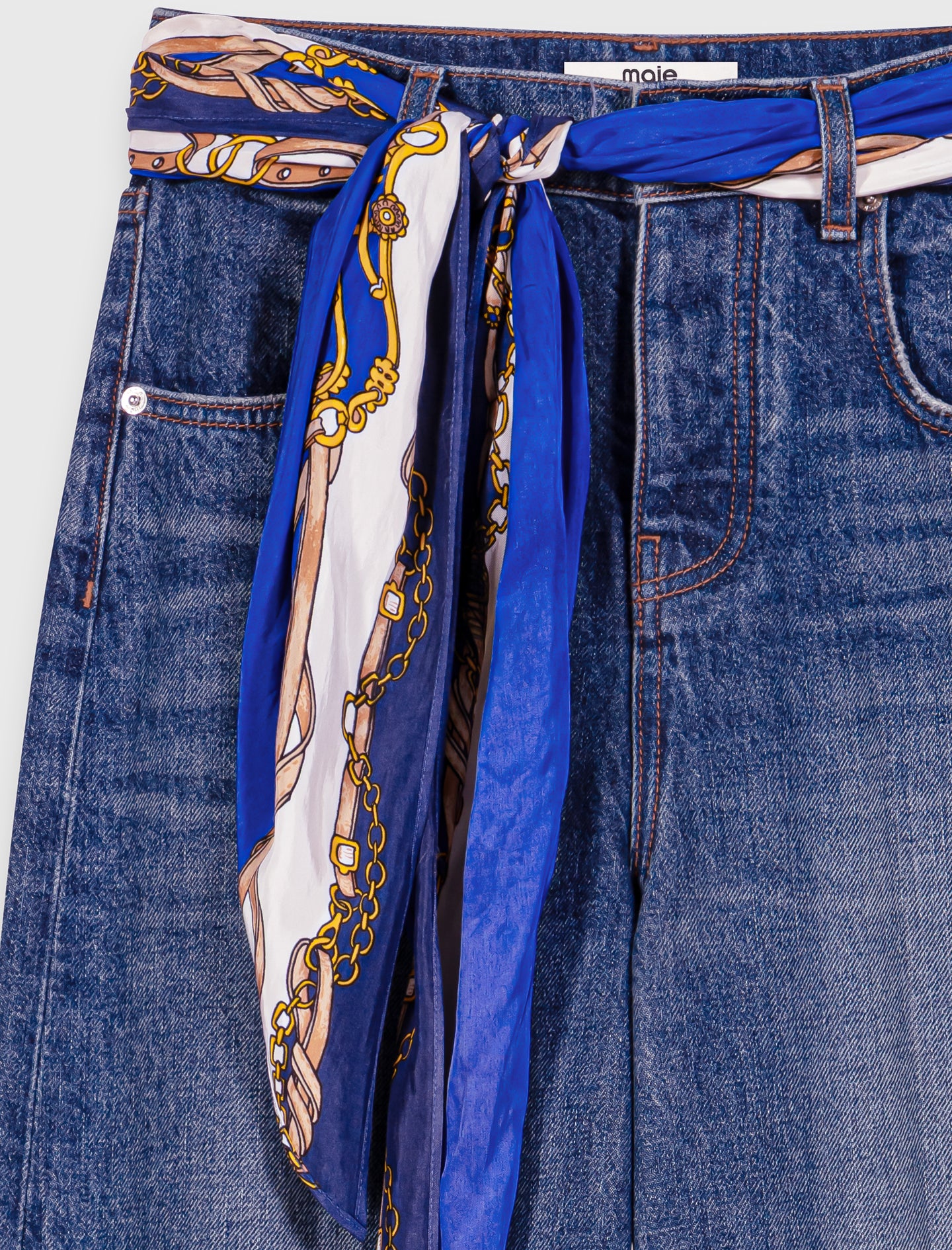 Carrot-cut jeans with a twilly Blue